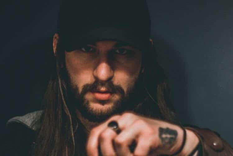 wearing baseball cap with long hair
